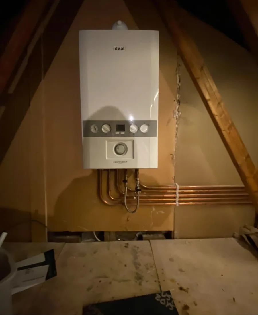 Ideal combi boiler installed in a boarded loft with new copper pipework, by TF Heating