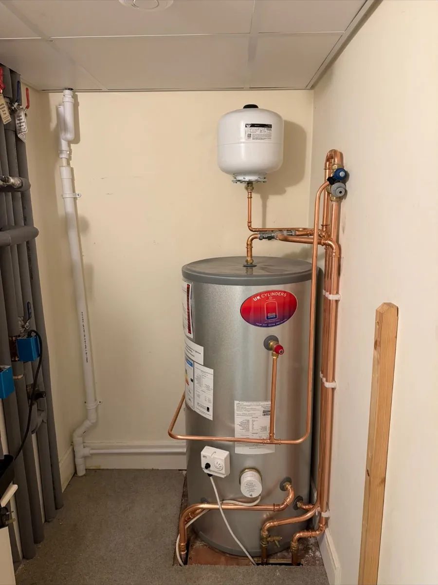 Unvented hot water cylinder with expansion vessel and copper pipework, by TF Heating